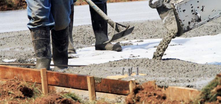 wet concrete being poured