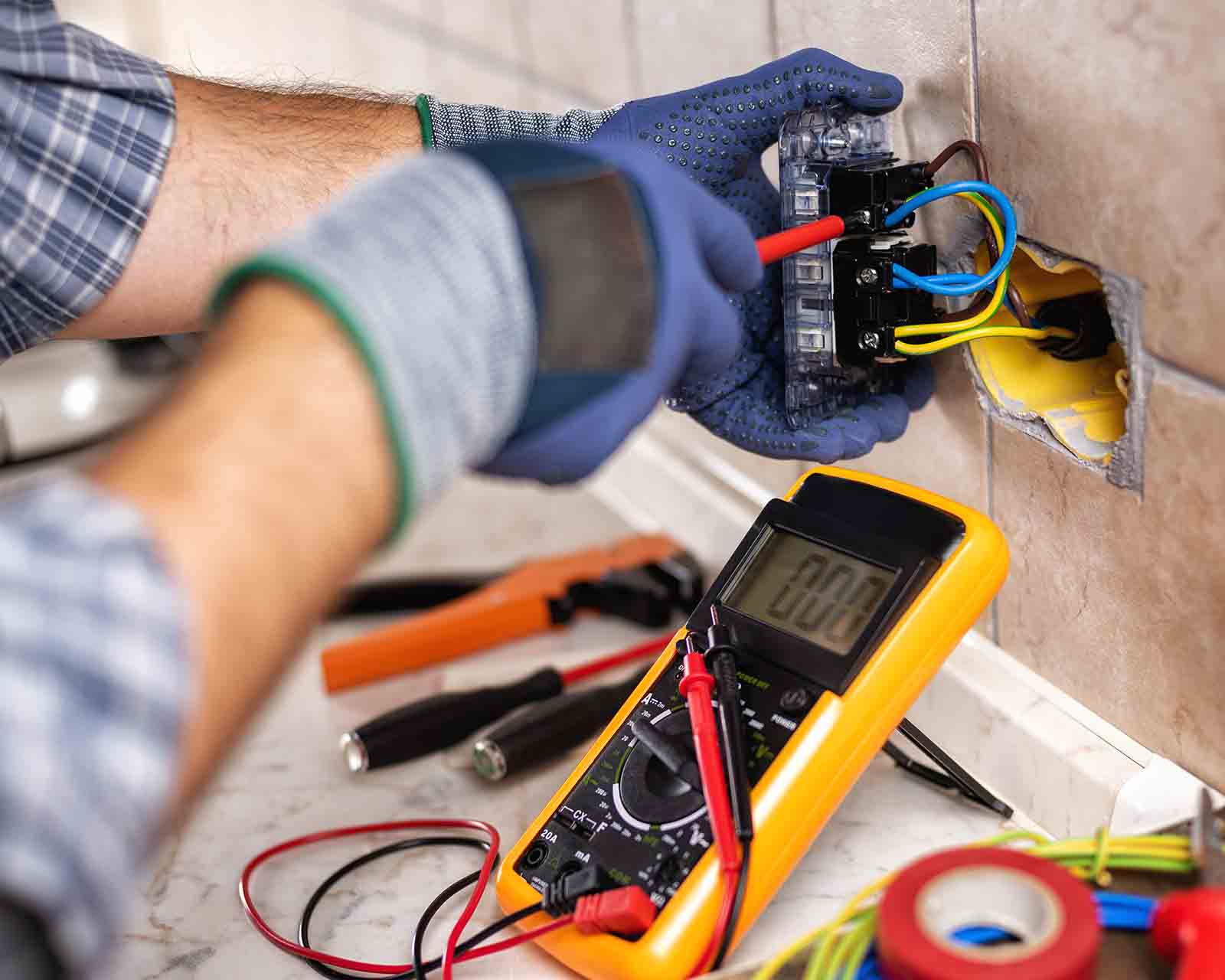 electrician working on a power outlet