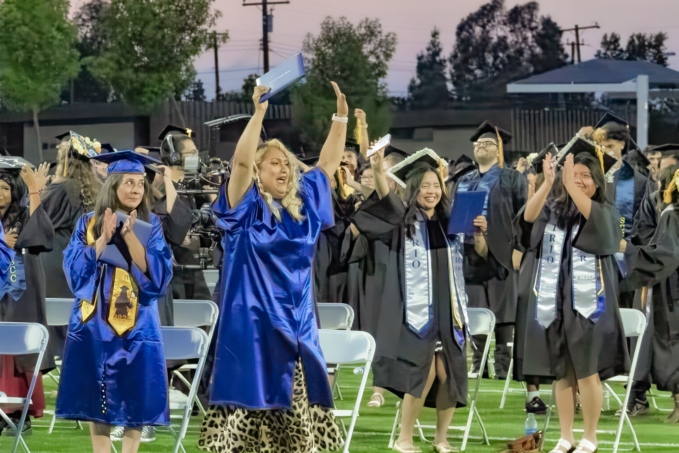 students cheering during graduation