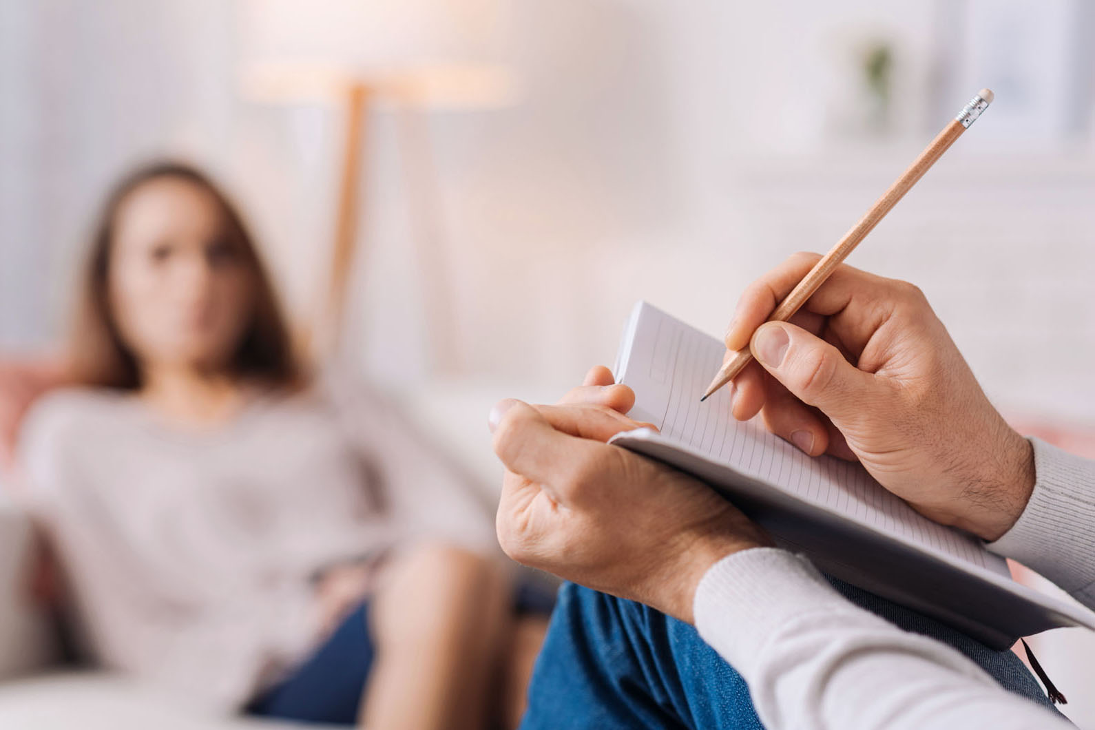 therapist taking notes with patient
