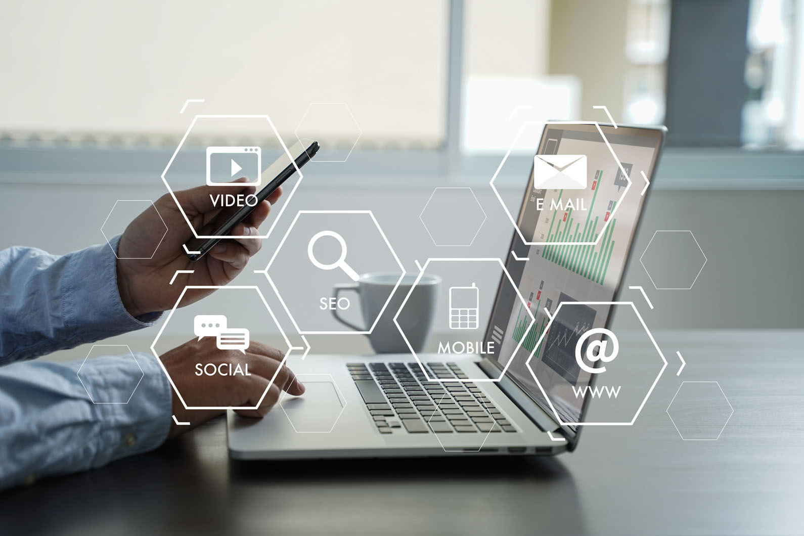 marketing words floating over a laptop